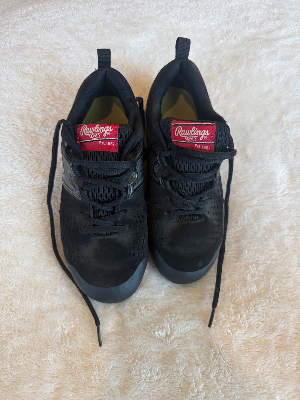 Rawlings Boy’s Black Cleats with Red Logo Tabs